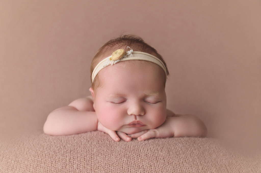 Newborn Baby Girl on pink blanket