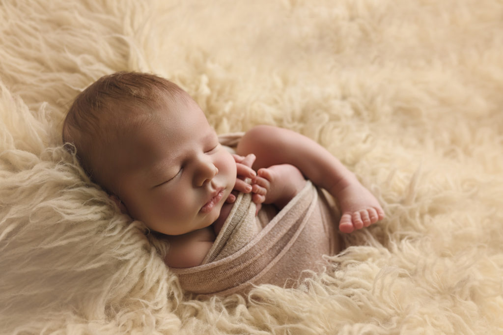 Raleigh Newborn Photographer Newborn Baby in white fur