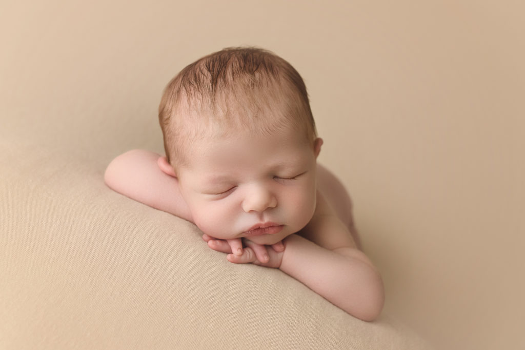Raleigh Newborn Photographer Newborn baby boy with chin on hands