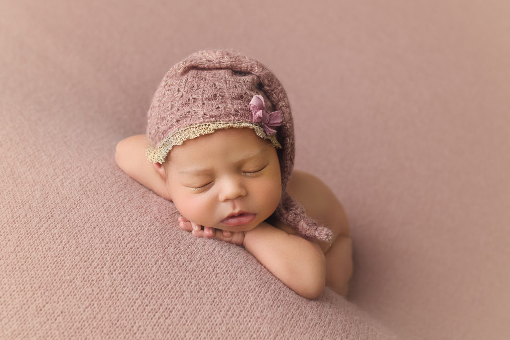 Newborn Baby Girl Ella on pink blanket with sleepy hat