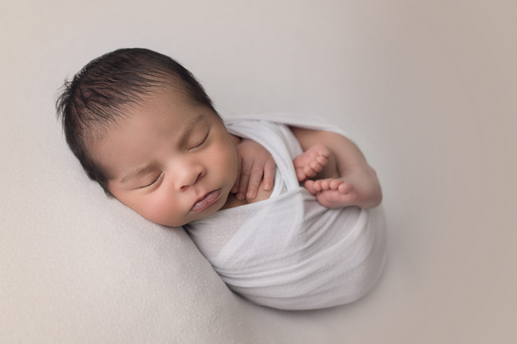Baby Newborn Boy wrapped in white