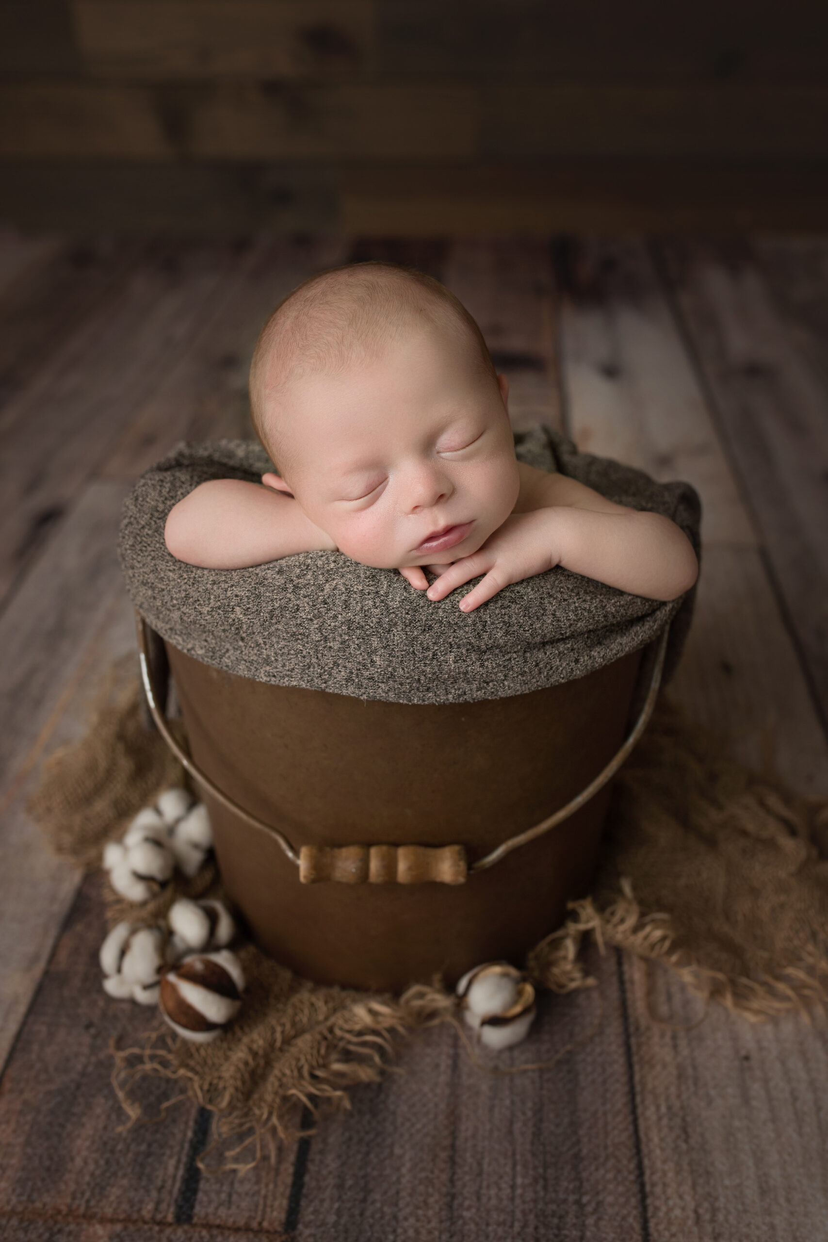 Newborn Baby in bronze bucket with cotten