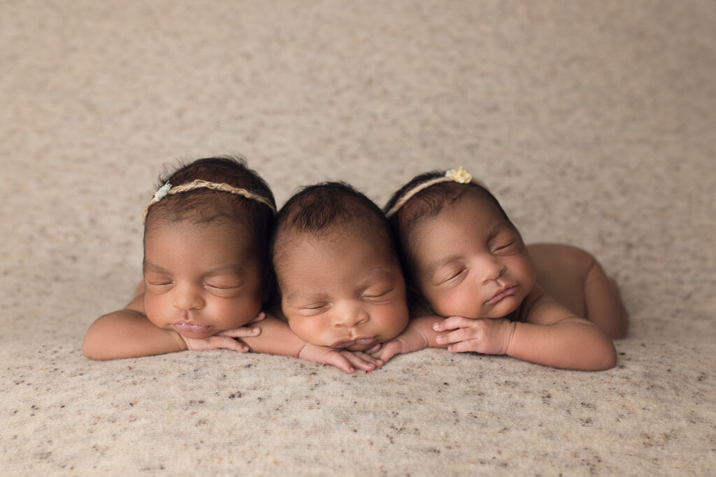 newborn triplets face forward