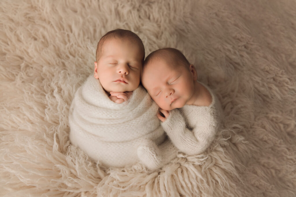 Newborn Baby twin boys wrapped in cream on cream fur Newborn Photography in Raleigh