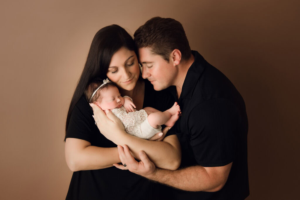 Portrait of newborn baby with parents, gentle family photography, Sally Salerno Photography